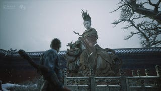 A Chinese statue stares down at the protagonist in Black Myth Wukong.