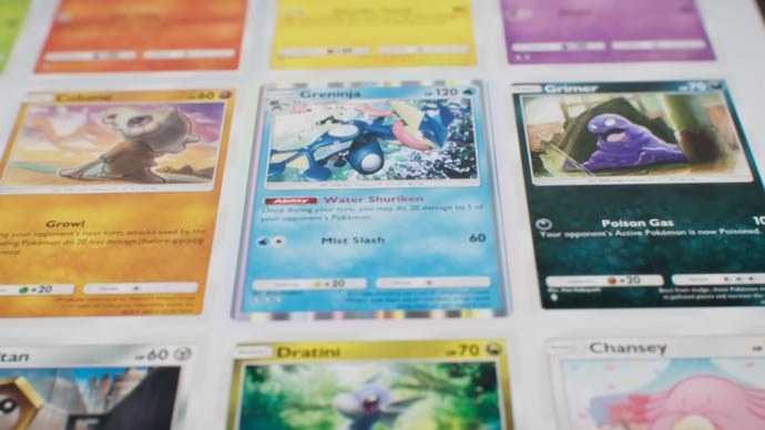 A selection of Pokemon cards laying flat in a digital space.